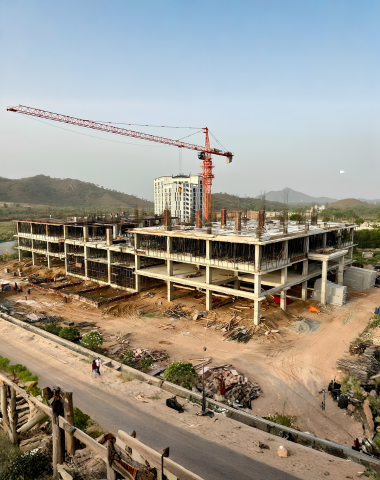 Hospital construction site with MEP systems installation in progress